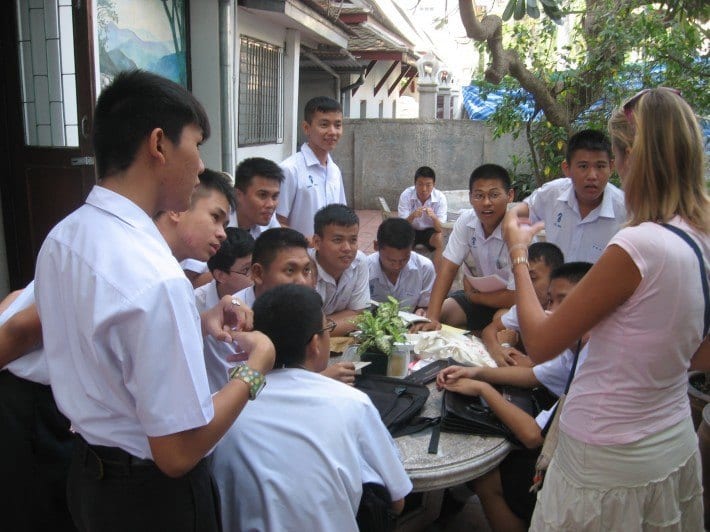 Caz talking with some students at Wat Saket High School