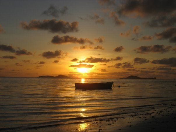 Sunset over Cousine Island from Praslin beach