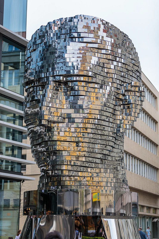 mirrored tiles creating the Rotating statue of the head of Franz Kafka in Prague