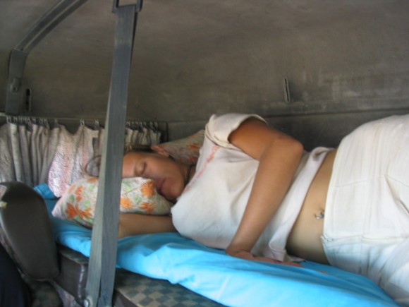 girl lying in truck cabin
