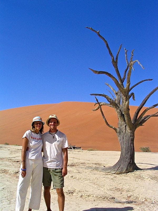 caz and craig in front of dead tree and sand dune