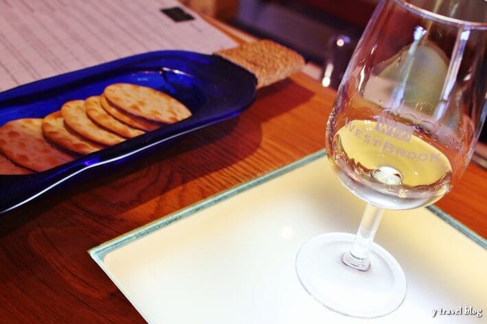 glass of wine and crackers on table