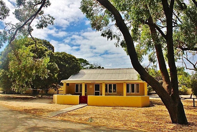 Yellow cottage in the sand at Rottnest