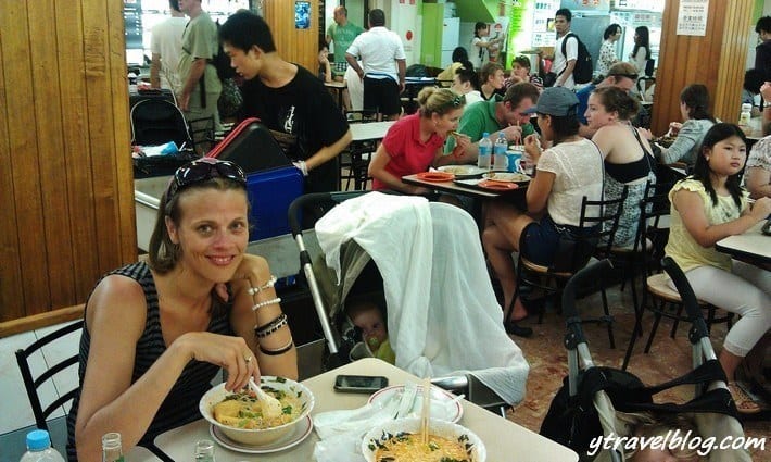 people sitting at tables in restaurant