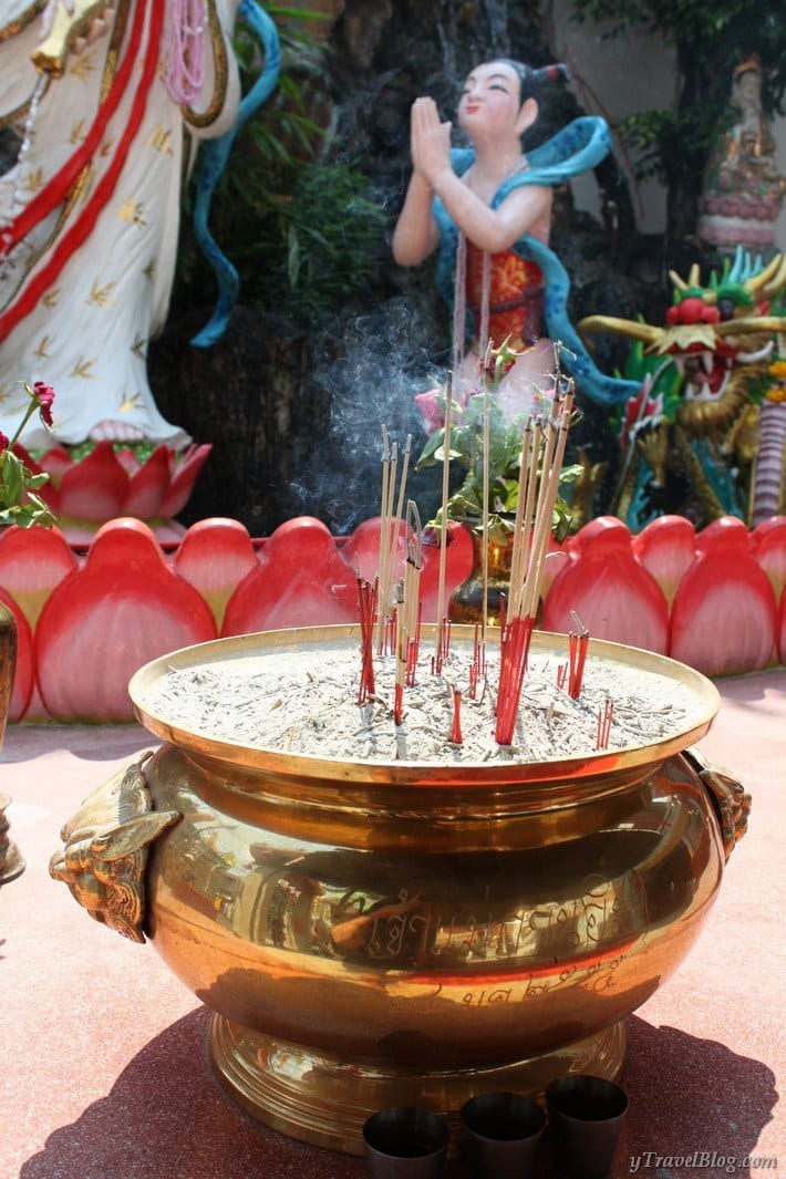 incense offering in gold bowl outside Chinatown Bangkok temple
