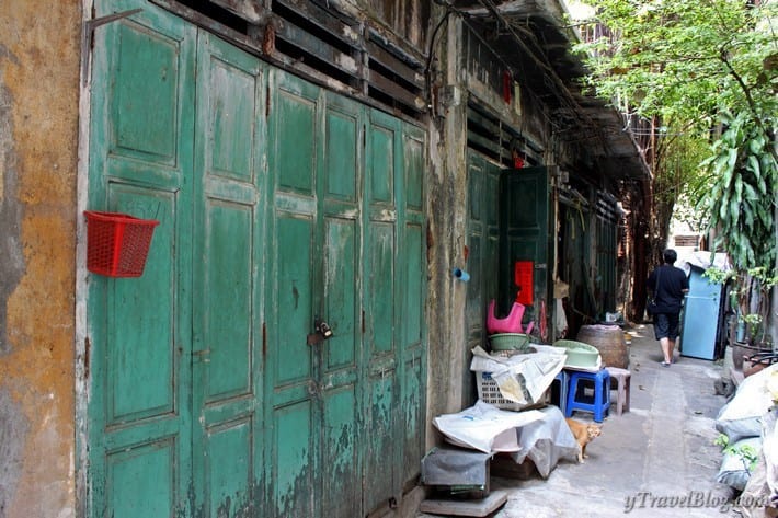 green doors of old buildings in chinatown bangkok