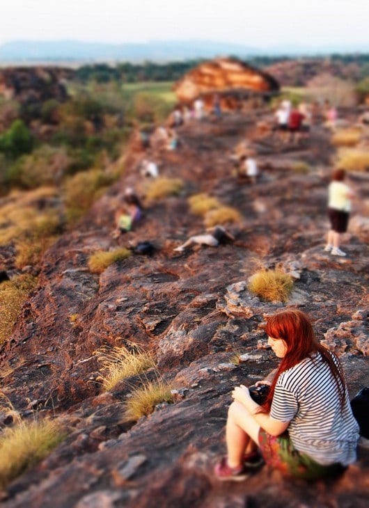 people sitting on rocks
