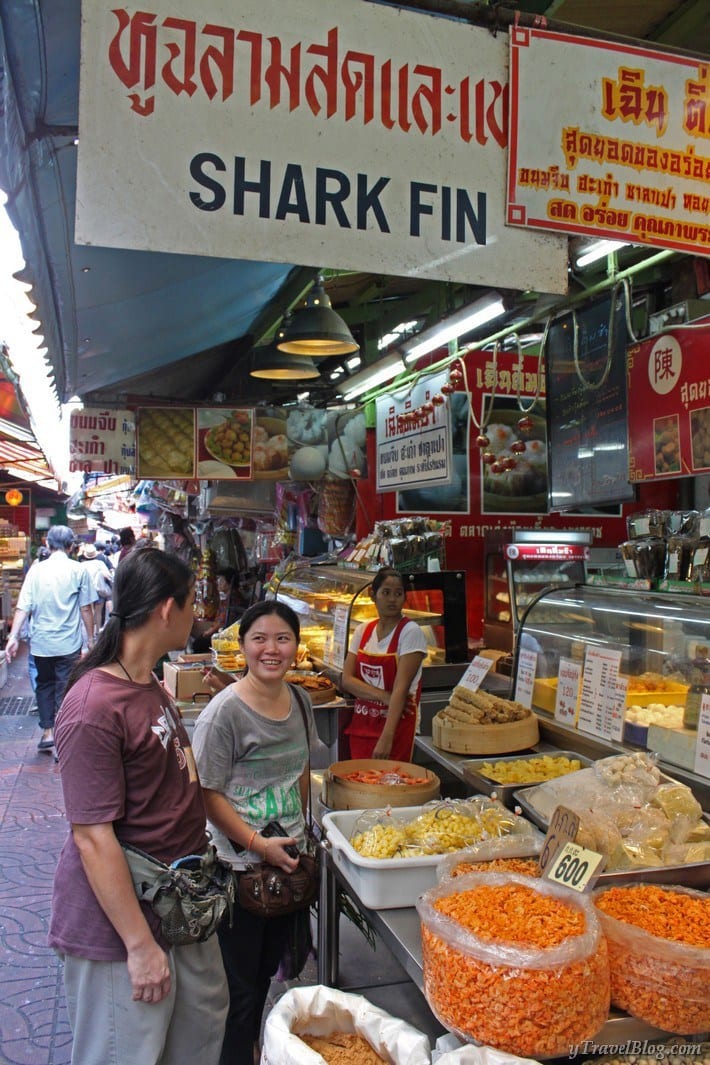people shopping at food market chinatown bangkok