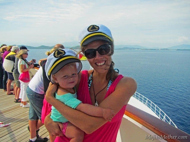 mom and daughter posing with captain hats on