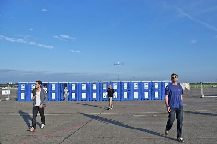 people standing in an empty parking lot