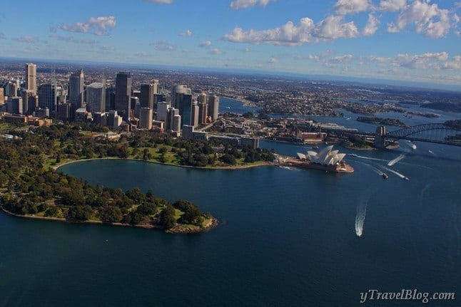 aerial of sydney harbour, opera house and tall buildings