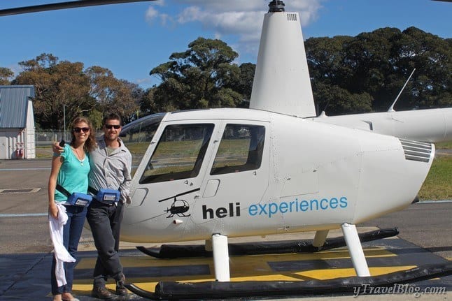 caz and craig in front of helicopter