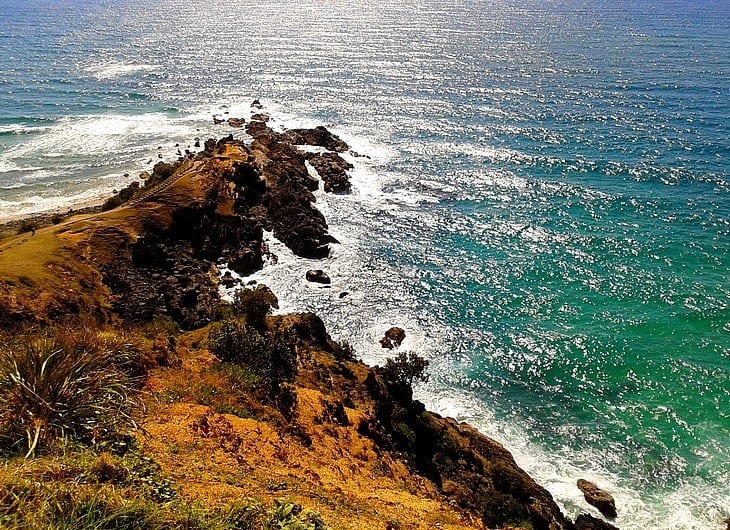 rocky cliffs next to the ocean