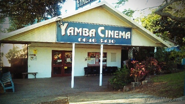 an old white building with yamba cinema on the sign