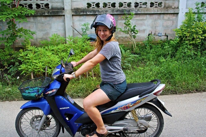 woman on a scooter in thailand