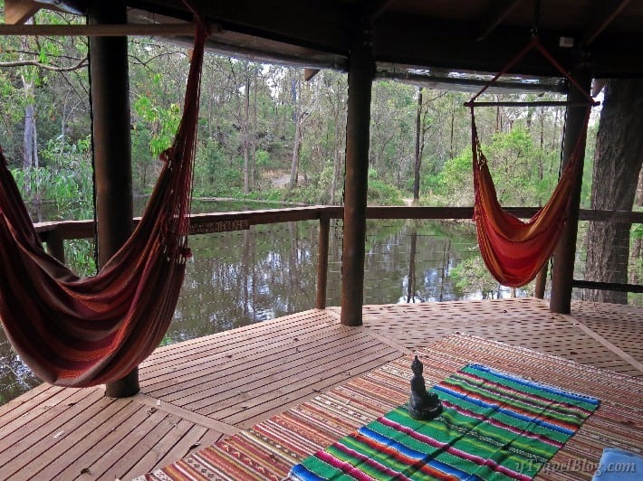 hammocks on a pagoda by lake with forest views