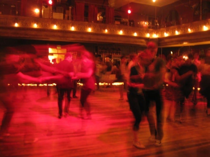 people dancing on a dance floor