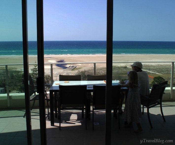 people on balcony looking at view of Kirra Beach 