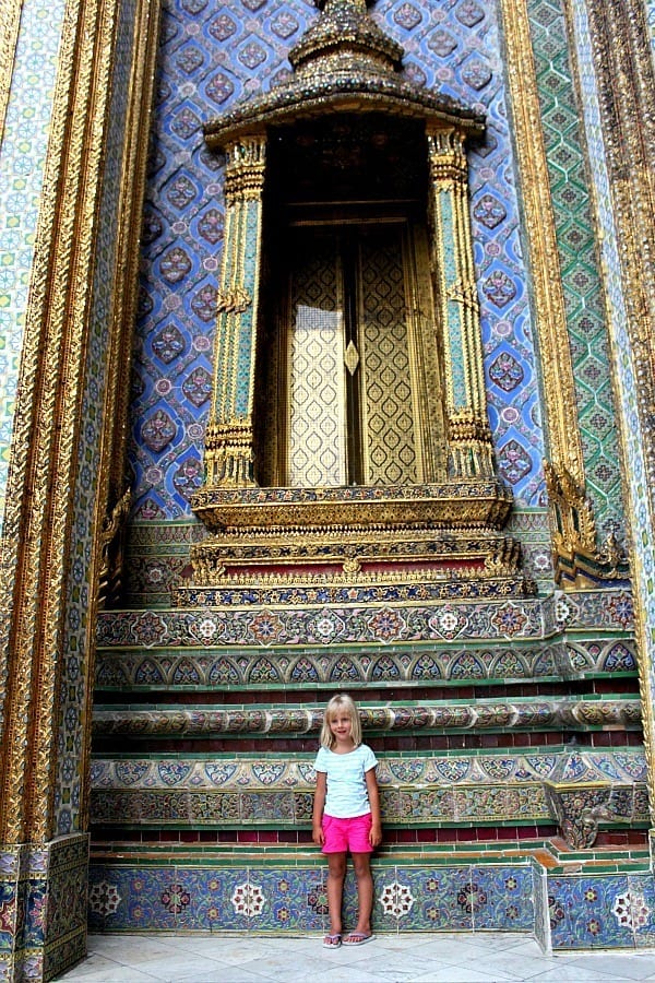 Girl standing in the huge mosaic door