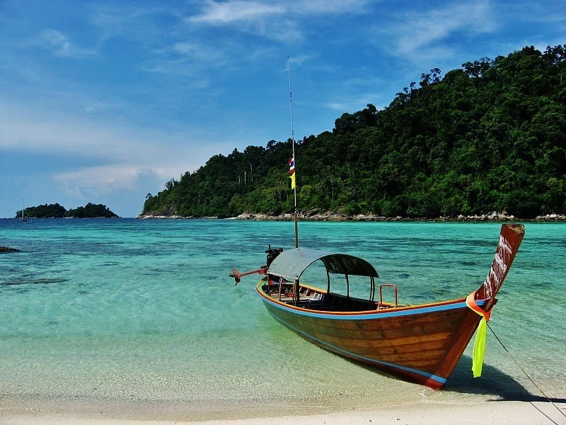 longtail boat in the water at ko lipe