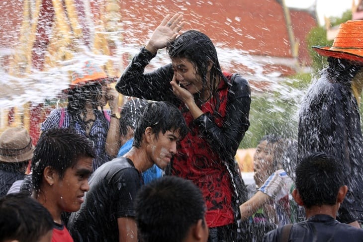 people getting water thrown on them during Songkran