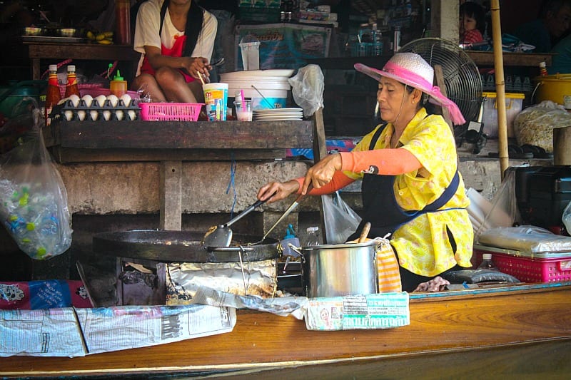 woman cooking food on a grill