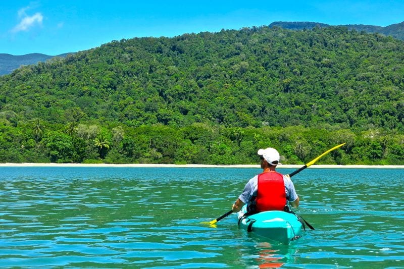 man kayaking in a lake