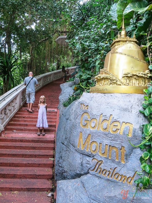 kalyra walking up stairs of Golden mountain