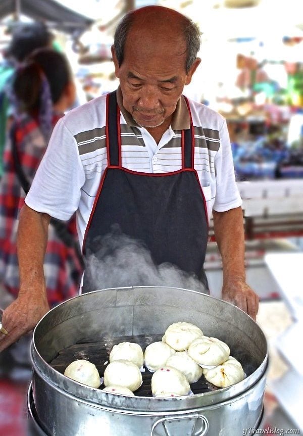 man cooking Thai Street Food in chinatown