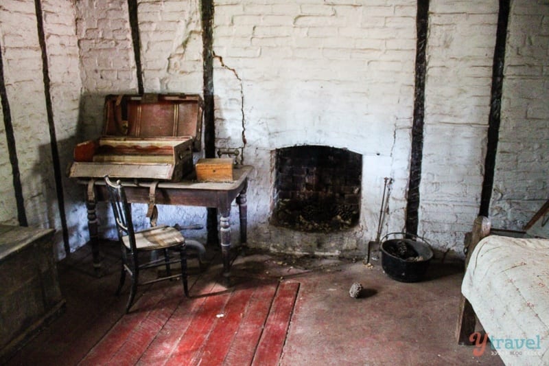 old bed and desk inside William Archer cottage