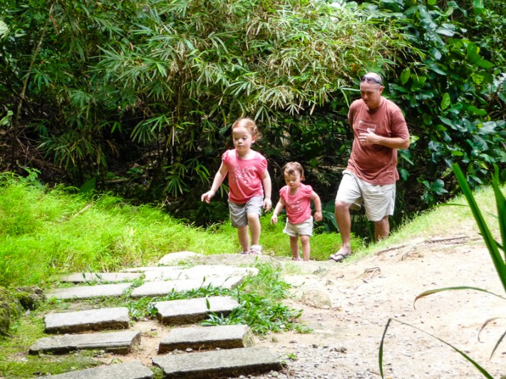 dad and two kids running up stairs at the the Spice Garden Penang Malaysia