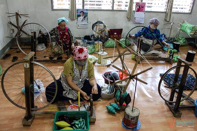 women sitting on floor sewing of doi Tung Royal Project Chiang Rai Thailand 