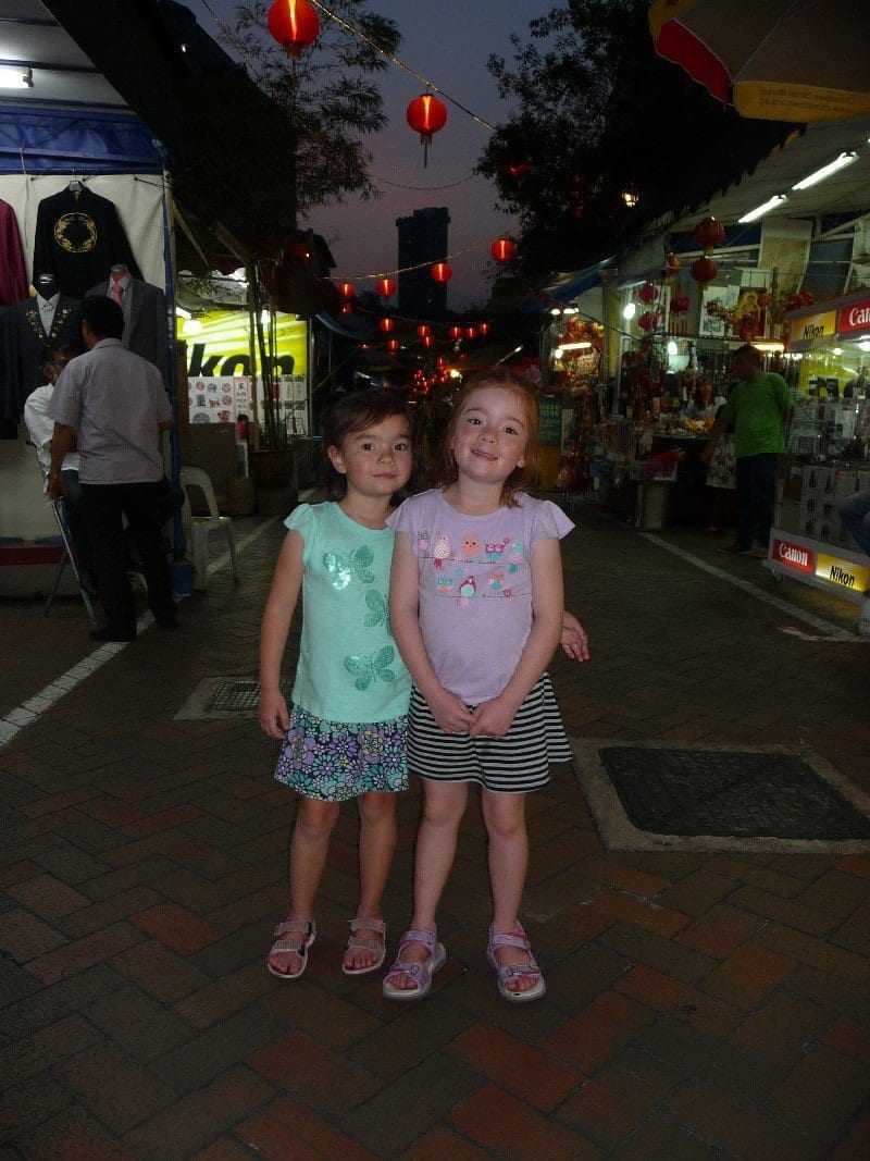 girls standing in a market