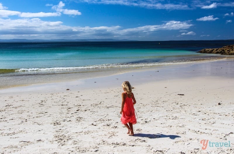 A girl standing on a beach