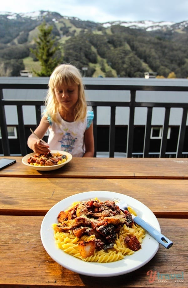 plates of food on table with mountain view 