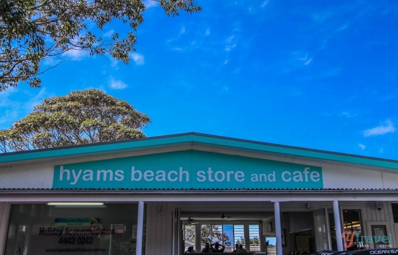 sign on building hyams beach store and cafe