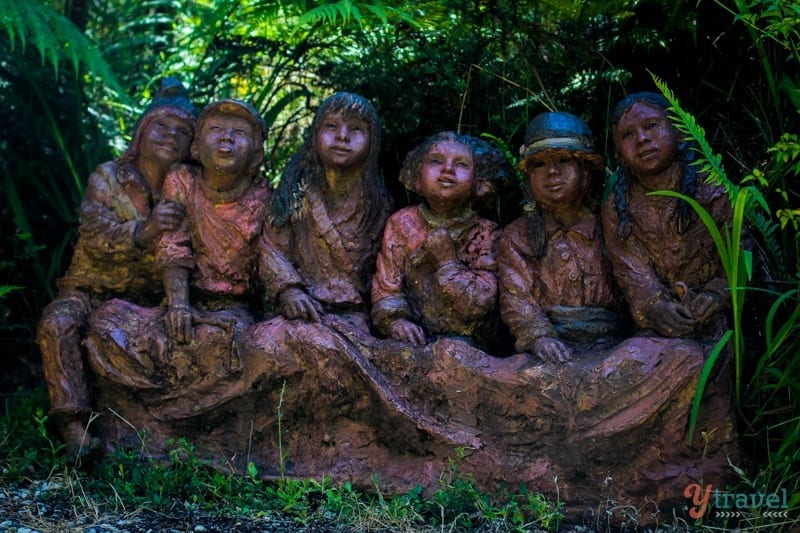 statues of kids in a park