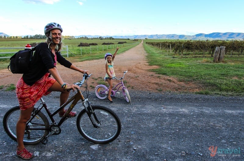 woman and child on bikes in the wineries