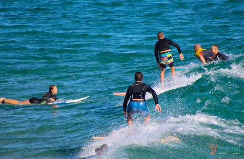 surfers on the waves at The Pass 