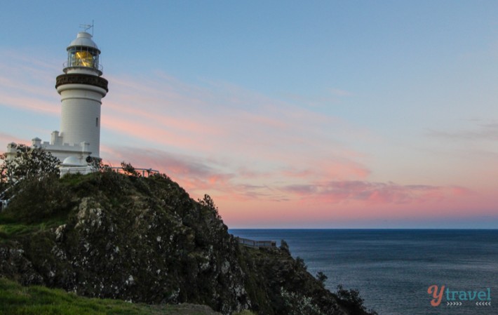 Byron Bay Lighthouse on edge of cliff at sunset