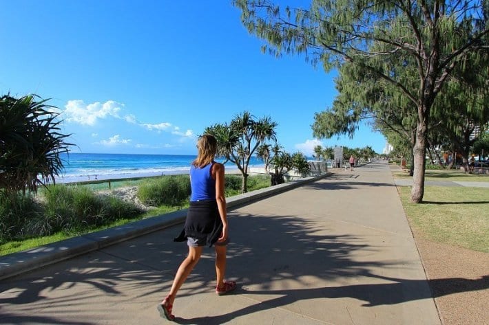 woman walking along the beach path
