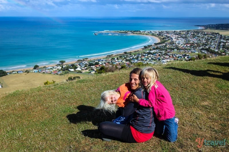 girls hugging at Mariners Lookout with view of Apollo Bay 