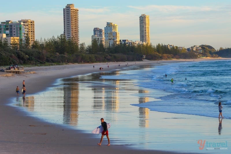 people walking out of surf at Burleigh Heads, Gold Coast, Australia