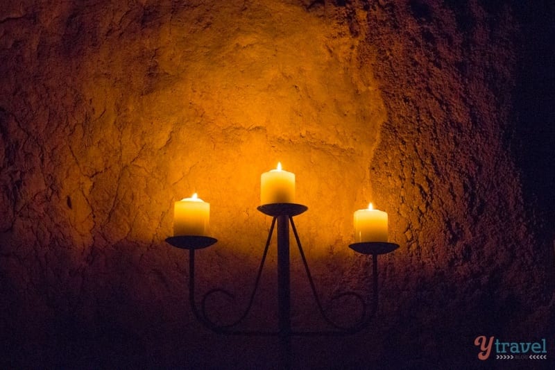 candles lit in a cave