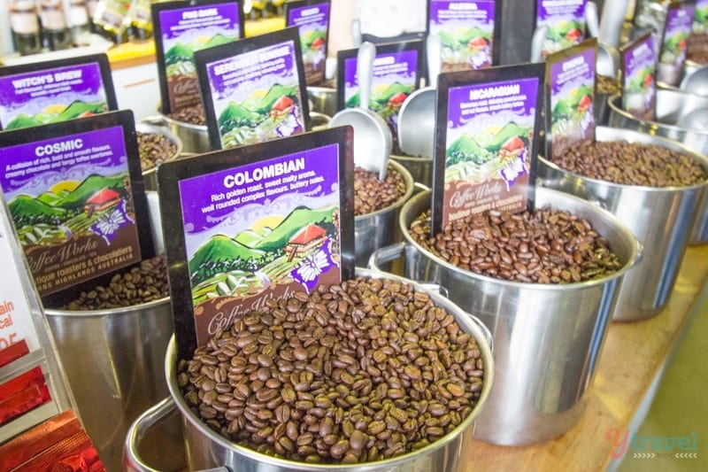buckets of coffee beans in a store 
