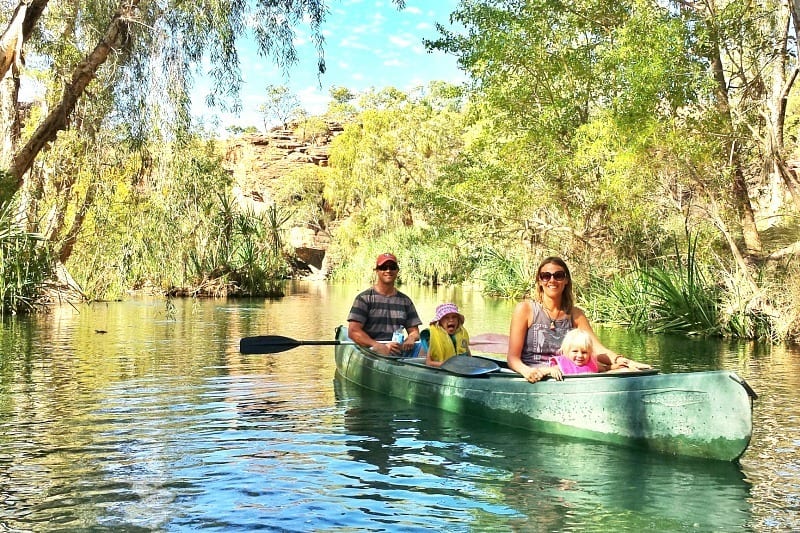 people riding in a canoe