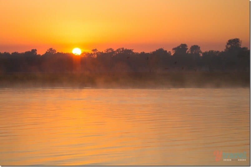 orange sunrise over billabong kakadu