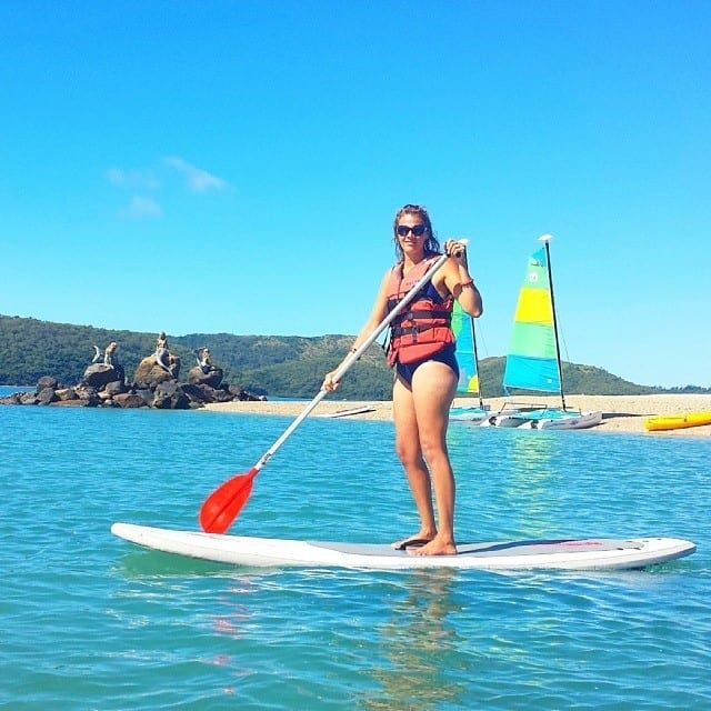 woman paddle boarding Daydream island, 