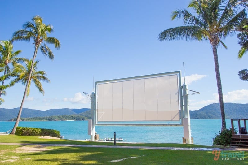 large movie screen next to the water