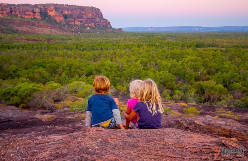 kids watching pink sunset at Kakadu National Park, Northern Territory, Australia